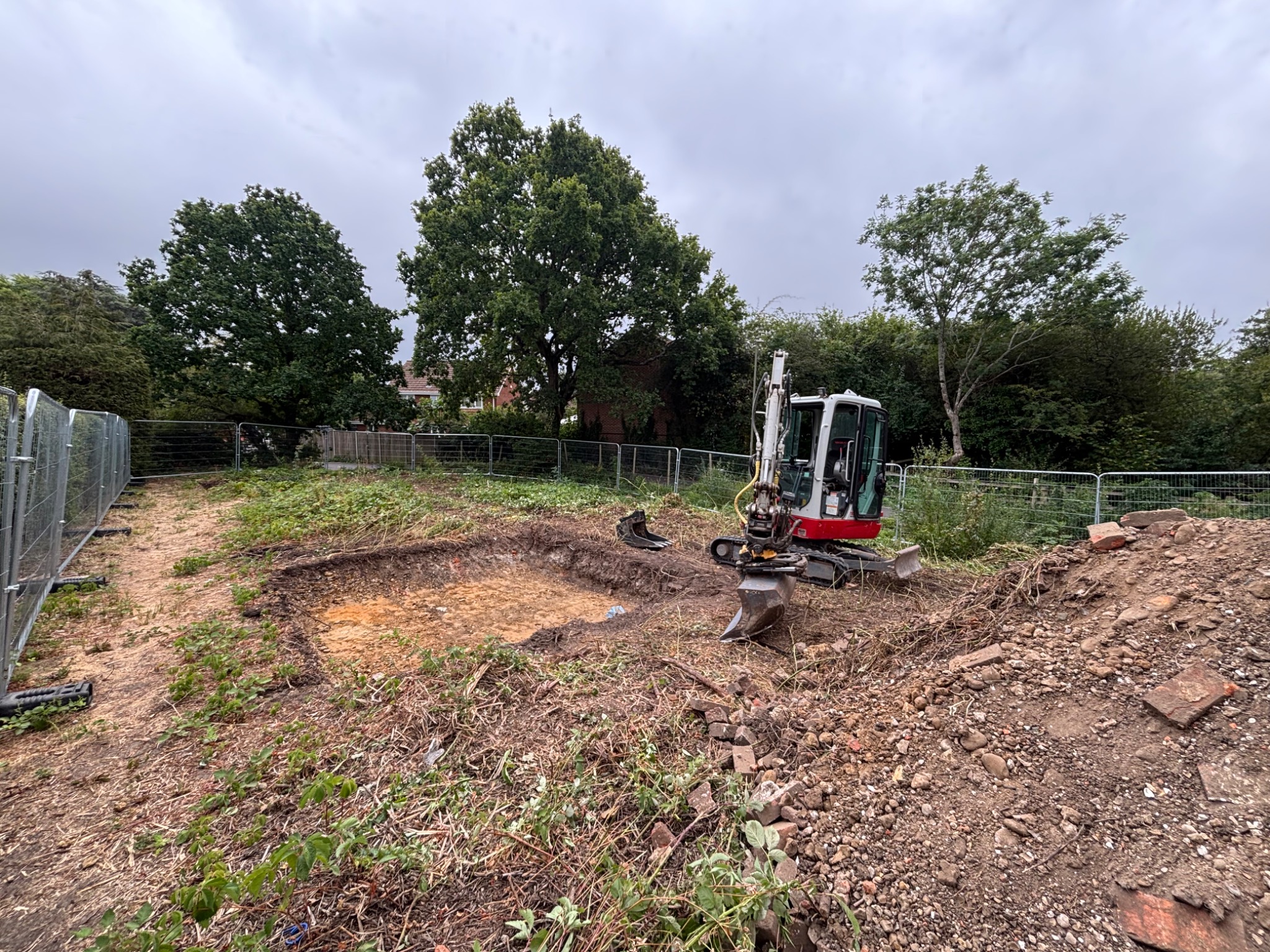 Excavator preparing a construction site